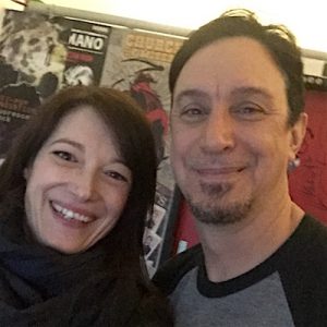 Left: Monica Mel of Global Rockstar (smiling) – Right: Lou Koller (smiling)
